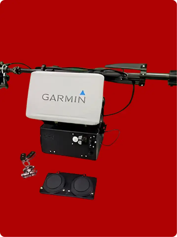 Garmin marine radar system with control panel and accessories displayed on a solid red background.