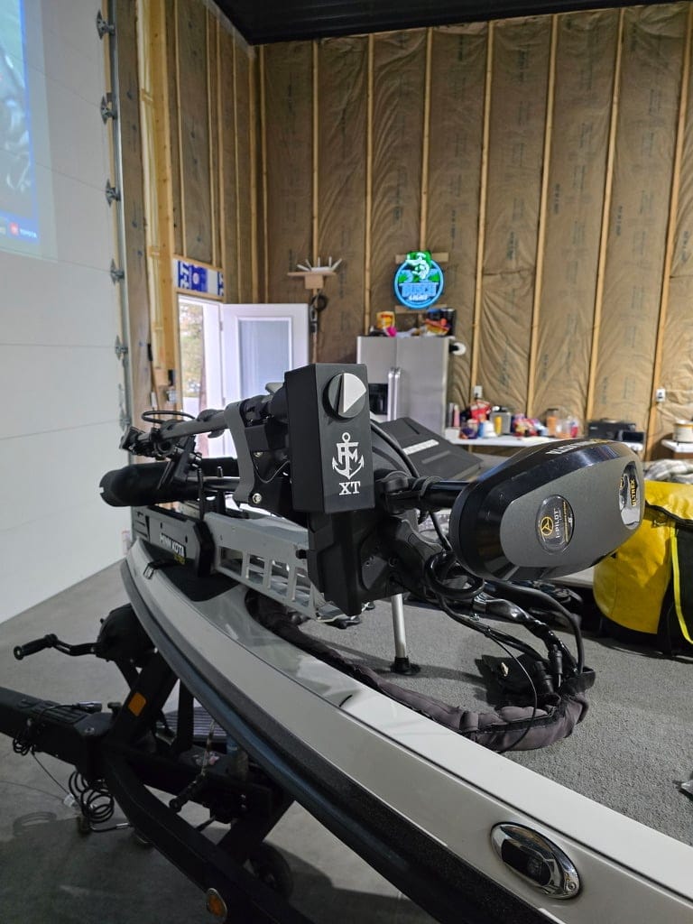 XT power head with the First Mate XT anchor mark, mounted next to a trolling motor
