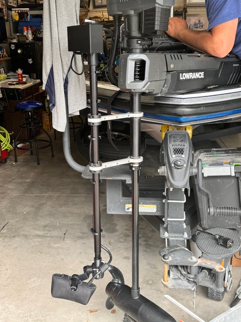 Two XT poles on the bench in the First Mate shop next to a Lowrance Ghost trolling motor