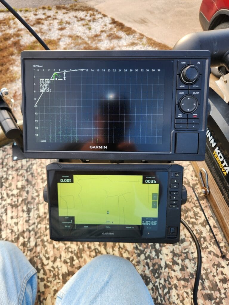 Garmin 10-inch GPSMAP showing LiveScope next to a Garmin 93sv on the deck of the Lowe Roughneck, Minn Kota Terrova behind
