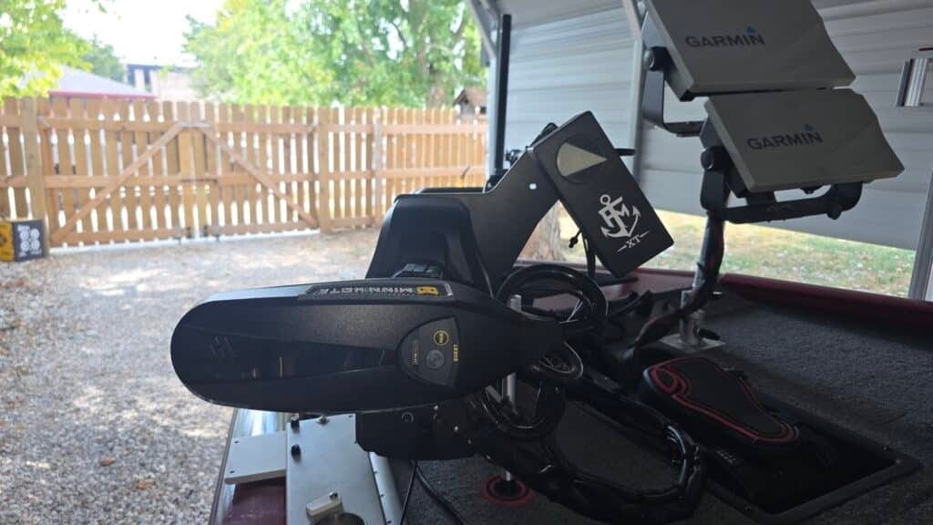 First Mate XT control head with the anchor logo mounted beside a Minn Kota Ultrex Quest, two Garmin units above