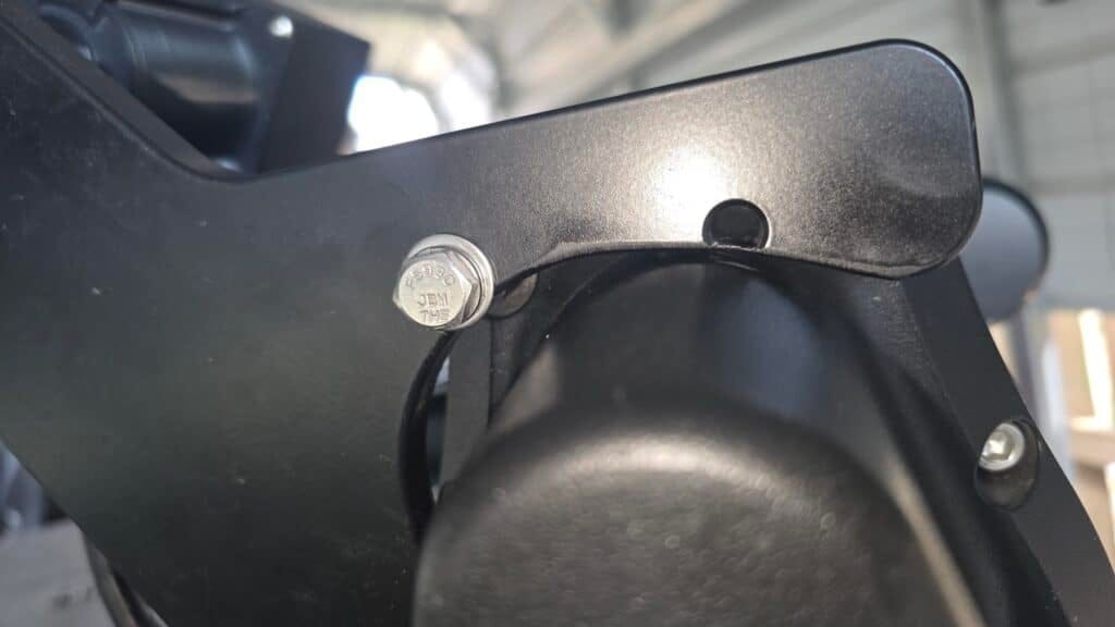 Close-up of the 2-inch stainless hex head bolt added to the upper part of the Ultrex mount for a third point of contact