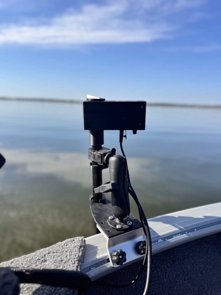 Close-up of the First Mate XT control head on a RAM ball mount bolted to a Cisco 42-degree Lund track mount on the gunwale